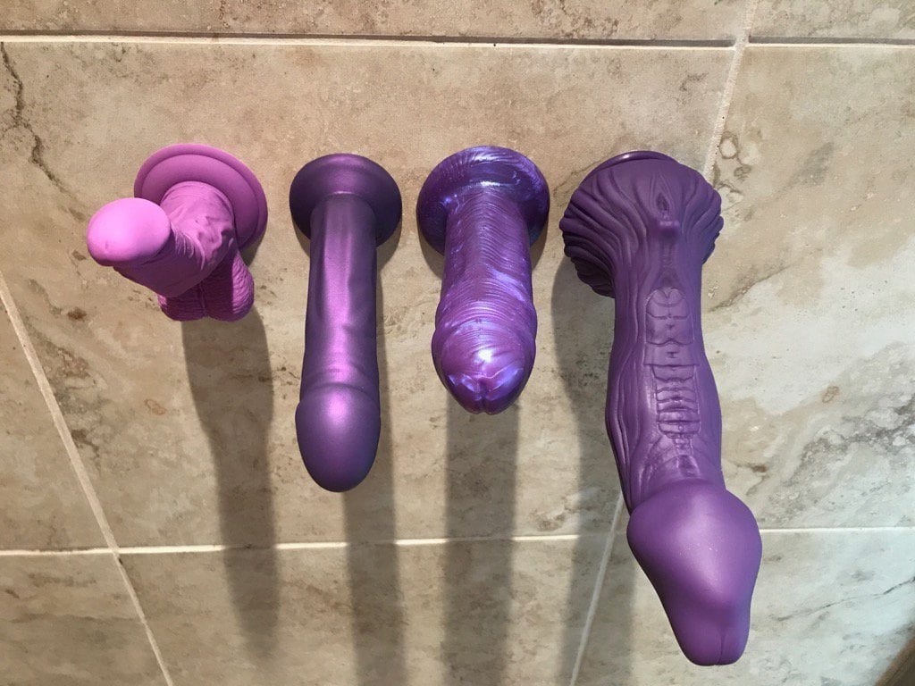 Purple suction cup dildos shower wall