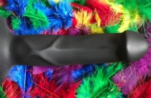 Fun Factory Boss dildo on bed of colored feathers