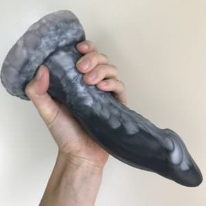 Bad Dragon Flint, with my hand wrapped around its large lower shaft