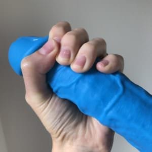 ColourSoft 8" dildo blue, hand wrapped around it