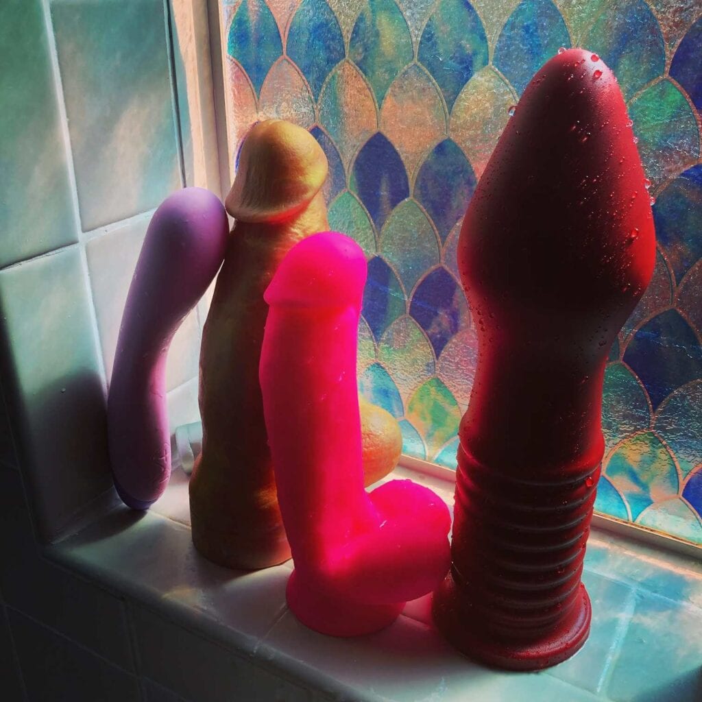 Tantus Fist Trainer vs. Nick Capra dildo by Hankey's toys and Neo elite 7 inch, Wellness G Curve vibrator in shower