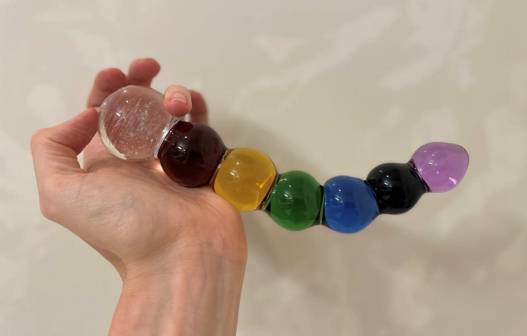 Crystal Delights Rainbow Bubble Dildo in hand