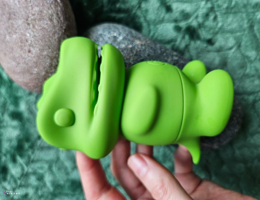 Dinosaur sex toy Little Goo clit sucker by rocks and hand