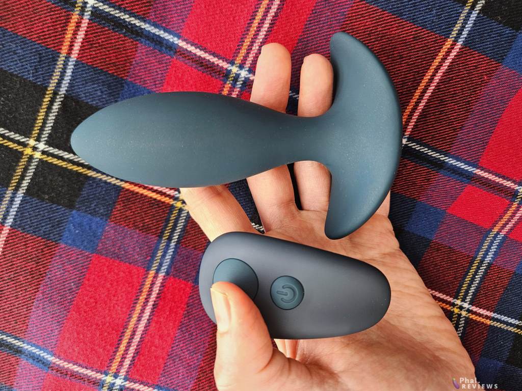 Lux Active Throb thrusting butt plug with remote - held in hand