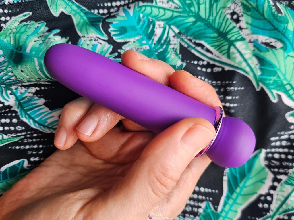 Maia Jaguar intense bullet vibrator review – purple vibrator in hand over green leaf print background