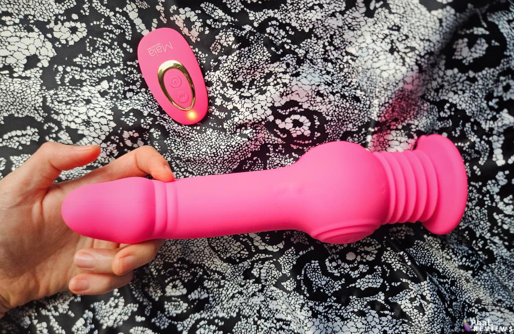 Maia Tegan jumping dildo with remote control in hand