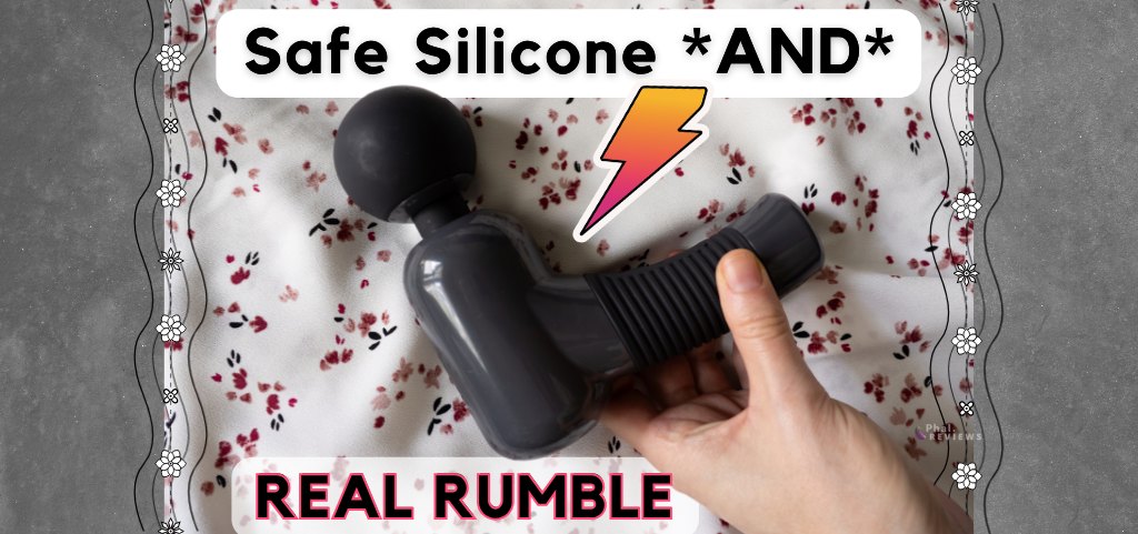 Black and gray Super Power Massage gun being reached for by hand, in front of floral red, pink, black background. Overlaid text reads "Safe silicone *and* real rumble"