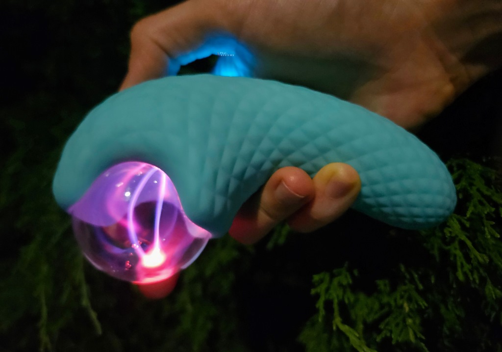 The Orb vibrator glowing sex toy with pink purple light rays