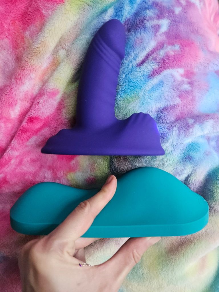Comparison of Thrill Ride smaller soft bump and VibePad Intense larger firm bump, with finger indicating clitoral contact point on VibePad