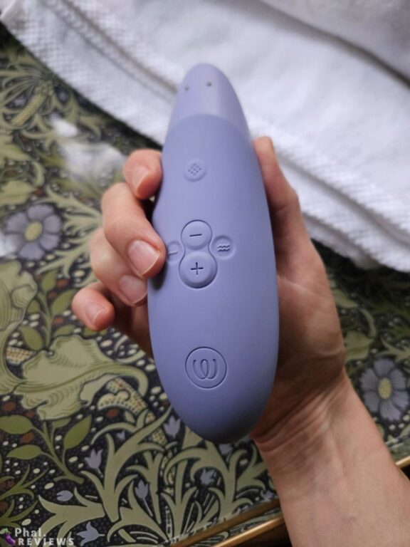Close-up of Womanizer Enhance five-button control layout