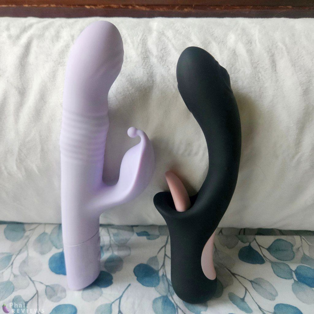 Xara G stroke stands next to Glossa vibrator on a eucalyptus bedspread, in front of white pillow