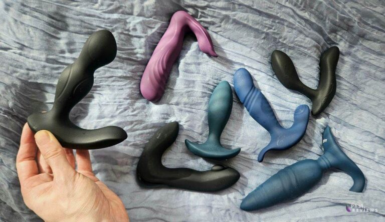 automatic prostate massager shown alongside multiple thrusting anal plugs and prostate massagers for size and function comparison