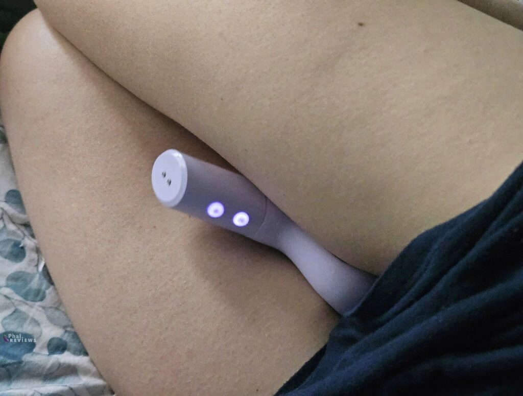Hands-free positioning of automatic G-spot vibrator braced between thighs